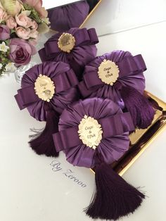 purple flowers are sitting in a vase on a table