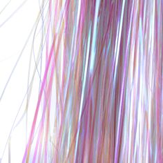 an abstract photograph of pink and white hair with long streaks on it's side