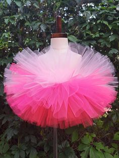 Sparkle, shimmer, twirl and spin, This tutu's where the fun begins, For dress up, play, or just because, All for the little girl you love. This bright colored Ombre tutu is made with Red, hot pink and bubblegum pink tulle. Our tutu band's are made from a crocheted material. They are quite stretchy and will fit from newborn up to a 24" waist. To measure start at the belly button and go around the waist. You may choose from 6" length to 13" length.  The shorter the length the fluffier it will be. Halloween Tutu Costumes, Infant Tutu, Costume Tutu, Tutu Birthday, Dance Tutus, Halloween Tutu, Kids Tutu, Ballerina Tutu, Toddler Tutu