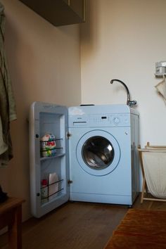 a washer and dryer in a small room