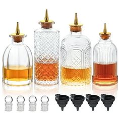 several different types of glass bottles with lids