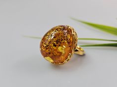 Amber ring. Brown cognac Amber. Certificated Sterling silver 925 with stamps - hallmarks. Big nice stunning ring. Adjustable size. Very big and stunning amber gemstone ring.  weight  16,82 gr GOLD plated ring.  Stone size - 3 x 2,5  cm This item was made of natural Baltic Amber. All the amber used in my jewelry is collected in my home country Lithuania.  I sell only genuine,  real, not pressed, authentic, natural Baltic Amber. Item may have natural imperfections. Formal Gold Cabochon Signet Ring, Luxury Amber Rings For Formal Occasions, Gold Crystal Ring With Polished Finish For Formal Occasions, Oval Dome Ring With Prong Setting As Gift, Classic Amber Rings For Formal Occasions, Gold Cabochon Signet Ring Gift, Gold Signet Ring With Cabochon Gift, Dome Ring With Prong Setting As Gift, Classic Gold Cabochon Diamond Ring