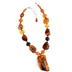 Polish Ddigner masterpiece! The centerpiece stone has so much depth of beautiful colors developed over millions of years. All Baltic Amber! Stones: Amber Length: Adjustable length approx. 17" - 19" Width: Center amber piece approx. 2 1/4" long x 1 1/4" wide and is approx. 1" thick (depth) Material: .925 Silver Made in: USA Amber Stone, Baltic Amber, Stone Necklace, Sterling Silver Necklaces, Cognac, Beautiful Colors, Poland, 925 Silver, Amber