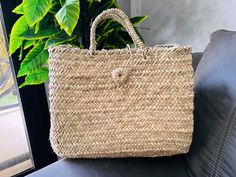 This bag is handwoven in the souks of Morocco, from a palm leaf. It is a "Slow Fashion" product representing everything that is eco, ethical and green. Even though this Spring & Summer season is all about straw 🤍 Small round wicker French basket, hand woven in Marrakesh by friends and family. Ideal small shopper or beach bag. Also a perfect bag or gift for a girl - great for school books etc. This braided bag is perfect anytime and everywhere, Especially in the summer and there are those who li Natural Weaving Beach Bag For Market, Artisan Natural Straw Bag For Market, Fair Trade Palm Leaf Straw Bag For Market, Artisan Natural Beach Bag For Market, Artisan Basket Beach Bag For Market, Handmade Palm Leaf Straw Bag For Market, Artisan Natural Color Beach Bag For Market, Fair Trade Basket Beach Bag For Market, Eco-friendly Natural Beach Bag With Weaving