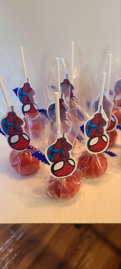 spiderman lollipops in cellophane bags on a table