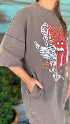 Women's Mocha Rolling Stones Angel Graphic Tee Rolling Stones Washed Graphic Tee Get the ultimate vintage rock and roll vibes with our Rolling Stones Washed Graphic Tee. The mocha color and distressed details give off western vibes while the angel wings on the iconic tongue graphic add a unique twist. Perfect for any music lover (or angel). Shop more from our Top collection HERE! Details Available in sizes: S-L Available in color: Mocha Angel Wings Rolling Stones graphic Distressed details Short Distressed Brown Summer Tops, Brown Graphic Print Top For Festival, Retro Stonewashed Summer Tops, Vintage Stonewashed Tops For Fall, Angel Graphic, Western Vibes, Mocha Color, Long Sleeve Outerwear, Vintage Rock