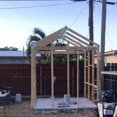 a house being built in the yard with a golf cart parked next to it and a utility vehicle nearby