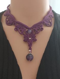 Unique Amethyst Stone and Macrame Woven Necklace This unique necklace is handcrafted using amethyst stones and the macrame technique. With a total length of 60 cm, it features an elegant design. The width of the pattern is 18 cm, and the pendant length is 7 cm. Thanks to its sliding clasp, you can easily put it on and take it off, and adjust its length as desired. Key Features: *Handmade and Unique Design: Each necklace is specially designed and unique. *Adjustable Length: Easily adjustable length with a sliding clasp mechanism. *Easy Cleaning: Clean it gently with lukewarm water. *Perfect Gift Option: Ideal for gifting to loved ones on special occasions, birthdays, or as a treat for yourself. Please Note: *Due to monitor settings, colors may vary slightly. This stylish and elegant necklac Macrame Necklace Pattern Simple, Woven Necklace, Amethyst Stones, Necklace Simple, Unique Necklace, Elegant Necklaces, Simple Elegance, Amethyst Stone, Unique Necklaces