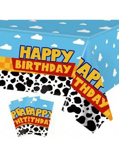 a happy birthday table cover with animal print