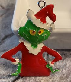 a red and green christmas ornament sitting on top of a counter