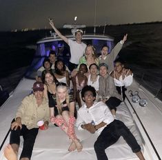 a group of people sitting on top of a boat