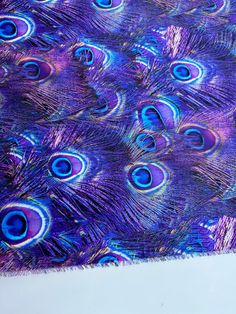 a purple and blue peacock feather pattern