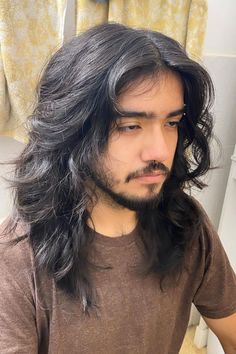 22 Handsome Long Haircuts for Men Men Layers Haircut, Men’s Long Shag Haircut, Long Wavy Mens Hair, Long Men’s Hair Cuts, Men's Long Wolf Cut, Dark Wavy Hair Men, Long Hair Haircut Ideas Men, 70s Shag Haircut Short Men