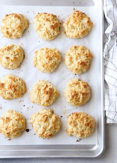 freshly made biscuits on a baking sheet ready to be baked in the oven or used as an appetizer