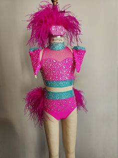 a mannequin dressed in pink and blue with feathers