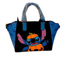 a black and blue handbag with an image of stitchy jack on the front