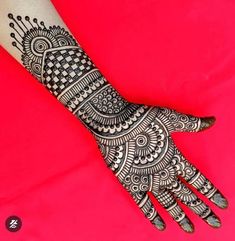 a henna tattoo on the arm and hand