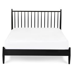 a black bed frame with white sheets and pillows on it, against a white background