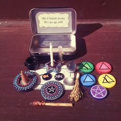 an assortment of items sitting on top of a wooden table next to a metal box