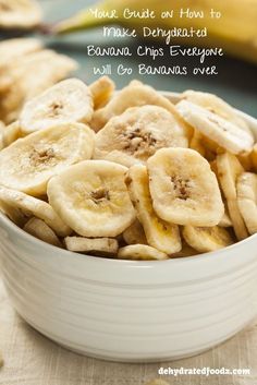 a white bowl filled with sliced bananas on top of a table next to a banana peel