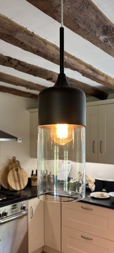 a light hanging from the ceiling in a kitchen