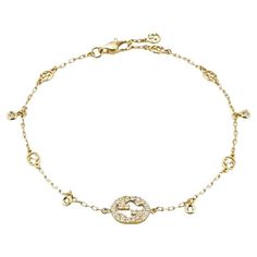 Gucci Interlocking G 18ct Yellow Gold 0.20ct Diamond Bracelet YBA729403002017 The Interlocking G jewellery collection takes a cue from the geometric logo, resulting in this design. Sparkling with Interlocking G details and set with diamonds, the 18ct yellow gold bracelet is ideal for everyday wear. - 18ct yellow gold - 30 diamonds, approximately 0.2ct - Interlocking G - Made in Italy Gucci White Gold Jewelry With Diamond Accents, Designer Gold Bracelets With Brilliant Cut, Designer Diamond Gold Bracelet In Yellow Gold, Gucci Diamond Jewelry With Diamond Accents, Luxury Hallmarked Yellow Gold Diamond Bracelet, Gucci Diamond Jewelry For Anniversary, Gucci Jewelry With Diamond Accents For Gift, Designer Yellow Gold Diamond Bracelet, Gucci Yellow Gold Bracelet For Formal Occasions