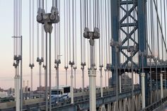 cars are driving across the bridge in traffic