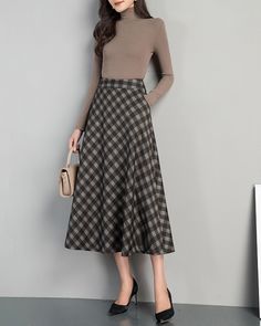 * A high-end midi plaid skirt with flare hem, very cool. * Made of cotton blends, fully lined and with two side pockets. * Fixed waist and side invisible zipper. * Can custom make waist size and skirt length. * Material: Outer-15% cotton, 85% polyester; lining-100% polyester * Size: True to US size, US 0-US 20 are available, you can let us know your usual size and height in your order. * Shipping: Free shipping Processing time : 5-7 Business days Delivery time : 7-20 Business days Tracking numbe Fall Gray Skirt With Pockets, Plaid Skirt With Pockets For Winter, Chic Long Plaid Skirt, Lined Gray Skirt For Fall, Gray Lined Skirt For Fall, Gray Full Skirt For Fall, Business Skirt Outfits, Midi Plaid Skirt, Long Skirt Vintage