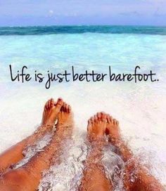 two people laying on the beach with their feet in the water and one is saying life is just better barefoot