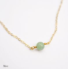 Jade is said to bless whatever it touches! It is lucky stone believed to create harmony within the mind, body, and spirit, while providing protection from harm. It is also said to attract money, love, and friendship. This necklace is handcrafted with a natural Jade stone. The stone is available in several colors including dark olive, light kelly green, nearly white green, and pea green. Choose to have this necklace made in sterling silver or 14kt gold filled. The stone size is 6mm (.25 inches). Dainty Jade Necklace, Jade Jewelry Necklace, Natural Gemstone Necklace, Lucky Stone, Love And Friendship, Mind Body And Spirit, Jade Necklace, Necklace Green, Attract Money