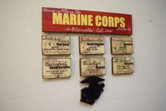 there is a sign on the wall that says marine corps and some magnets