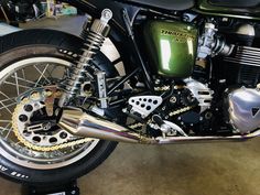 a motorcycle parked in a garage next to other motorcycles