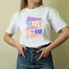 Show your BTS pride with our custom name shirts! Each shirt is designed to feature the names of your favorite BTS members--RM, Jin, Suga, J-Hope, Jimin, V, and Jungkook. These high-quality, personalized tees let you celebrate your bias and connect with fellow ARMY fans in style. Premium Fabric: Made from soft, breathable cotton for all-day comfort and durability. Stylish Prints: Features clean, bold prints of the BTS members' names, designed to stand out and showcase your fandom. Custom Options: Available in a range of colors and sizes to suit your personal taste and style. Versatile Wear: Perfect for concerts, fan gatherings, or casual wear, making it a great addition to any BTS fan's wardrobe. Express your love for BTS and add a personal touch to your fan gear with these custom name shir Bts Members Names, Bts Name, Bold Prints, Suits You, Custom Shirts, Casual Wear, Bts, Bathing Beauties, Adult Outfits