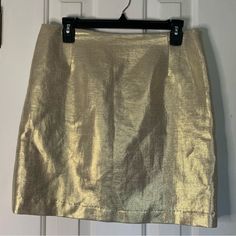 Brand: Eccoci Size: 8 Color: Metallic Gold Gorgeousness For The Season! Metallic Shimmer Fully Lined Skirt. Flat Waist 16”, Length 18” Hidden Side Zip, Tapered Waist, Fully Lined. Never Worn. I Am Cleaning Out My Personal Closet And Passing This Along. Excellent Condition. No Holes, Stains Or Flaws. In Fact, I Can’t Recall Ever Wearing This. My Loss Is Your Gain. Smoke Free Home. Ref 440 Gold Fitted Bottoms For Holiday Season, Fitted Gold Bottoms For Holiday, Fitted Gold Bottoms For The Holidays, Fitted Gold Holiday Bottoms, Gold Fitted Mini Skirt, Fitted Gold Mini Skirt For Spring, Fitted Gold Mini Skirt, Gold Lined Pencil Skirt, Fitted Gold Skirt For Spring