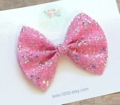 This beautiful Pink Glitter Hair Bow is the perfect accessory for girls of all ages! Looks so cute worn alone or attached to a nylon headband! Bow measures approximately 3 1/2 inches and is made of a beautiful pink glitter material with silver sequins scattered throughout. Bow comes attached to your clip of choice (single or double prong clip) that's been partially lined with matching grosgrain ribbon or a nylon headband in your choice of color Nylon headbands fit newborns up to adults Dark Pink Hair, Gold Glitter Bow, Hot Pink Glitter, White Hair Bows, Pink Hair Clips, Neon Hair, Glitter Headbands, Toddler Hair Bows, Pink Hair Bows