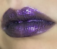 Spellbound is an enchanting royal purple lipgloss with a slight black shift and a hint of pink shimmer. Layer this gloss up on top of itself or a black liquid lipstick for maximum opacity. Made with pearlescent synthetic mica powder, and Coconut and Vitamin E oil for a smooth non-sticky gloss. It comes in Candy Apple flavored or Unscented in a 5ml tube.  (Vegan and cruelty free) Purple Lipgloss, Black Liquid Lipstick, Purple Lip Gloss, Shimmer Lipstick, Stocking Stuffers For Girls, Metallic Lips, Purple Lips, Lip Beauty, Black Liquid