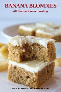 banana blondies with cream cheese frosting are stacked on top of each other in front of bananas