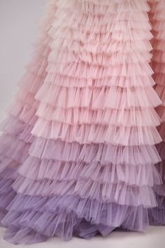 Frill-layered evening tulle dress features a semi-transparent corset with built-in cups, a frill-layered maxi skirt, and the train. The corset is adorned with delicate translucent straps that can be worn both on and off the shoulder. The gorgeous pink gradient train is made from cascading tulle layers. DETAILS Material: Tulle Fabric Composition: 100% polyester Sleeves style: V-neck straps Silhouette: Princess dress Skirt length from waist: 120 cm Neckline: Heart-shaped neckline Back: Lace-up cor Midi Tulle Dress, Cocktail Dress Code, Special Occasion Gowns, One Shoulder Prom Dress, Dress Weights, Bridal Jumpsuit, Pink Gradient, Tulle Ball Gown, Pink Gowns