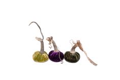 three different colored gourds are shown on a white background, one is green and the other is purple