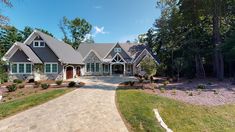 a large house in the middle of a wooded area