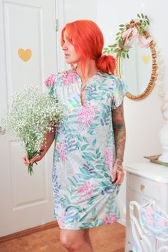 Details: The perfect summertime lounging piece is simple, lightweight, and soft on the skin; the nightgown is made of a unique nylon material printed with blue and teal leaves and magenta flowers. This material gives an earthy, almost fairy vibe. The neckline has a single button with a keyhole cut out, giving it a deep v in the neckline.  Brand: Vanity Fair Size: Small - The model is 5'3" with a 32A bust. Condition:  Excellent condition  Material: 100% Nylon *Please note - Signs of wear are typi Multicolor Summer Nightgown For Sleep, Summer Floral Print Sleepwear With Short Sleeves, Summer Sleepwear With Floral Print And Short Sleeves, Green Summer Nightgown For Sleep, Green Short Sleeve Summer Nightgown, Green Summer Nightgown, Multicolor Summer Nightgown For Bedtime, Floral Print Nightgown For Spring Vacation, Spring Vacation Nightgown With Floral Print