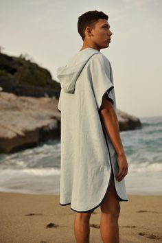 "Introducing our Linen Small Waffle Beach Poncho, the ideal addition to any man's summer wardrobe. Crafted with a perfect blend of style and functionality, this hooded beach poncho towel is a must-have for those sunny days by the water. Designed with the utmost comfort in mind, it combines the lightweight breathability of linen with a subtle waffle texture for added absorbency. Whether it's a day at the beach, by the pool, or after a refreshing swim, this linen poncho offers a quick-drying and stylish solution to keep you comfortable and dry. Its versatile design makes it an excellent gift for him, ensuring that he stays both fashionable and functional while enjoying the summer season. Elevate his beach or poolside attire with this Linen Small Waffle Beach Poncho, the perfect embodiment of Casual Poncho For Vacation, Casual Hooded Poncho For Summer, Casual Short Sleeve Cover-up For Warm Weather, Short Sleeve Cotton Poncho For Summer, Summer Vacation Poncho With Short Sleeves, Cotton Short Sleeve Summer Poncho, Casual Short Sleeve Poncho For The Beach, Hooded Cotton Poncho For Summer, Oversized Short Sleeve Poncho For Beach