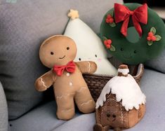 three stuffed animals sitting on top of a couch