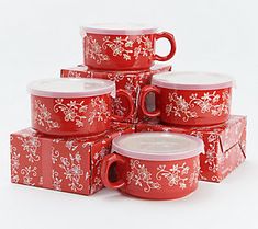 a stack of red coffee mugs sitting on top of each other