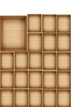 an open cardboard box with many compartments on the bottom and sides, all lined up in rows