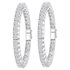 Single line 40 pointer each , 35.62 Ct Contemporary 18 Karat White Gold & Diamond Eternity Bangle Bracelet It features Two bangles crafted from 18k White gold embedded with 35.62 Carats of Round brilliant diamonds in two bangles . The pattern can be stacked with similar style bangles or worn as a stand-alone piece. Total Diamond weight 35.62 Ct Each Diamond size : approximately 40 pointer each Clarity SI1 and color G/H # of Diamonds in each bangle 44 Total # of diamonds : 88 18 K gold 61 gm Hing Single Line, Diamond Bangle, Diamond Eternity, Hinged Bangle, Diamond Sizes, White Gold Diamonds, Bangle Bracelet, Diamond Bracelet, Gold Diamond