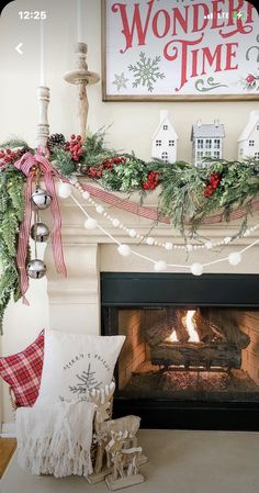 a fireplace decorated for christmas with stockings and garland