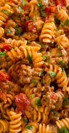 pasta with meat and tomato sauce in a bowl