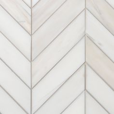 white marble herringbone tile with grey veiners