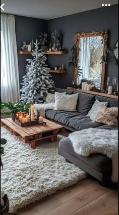 a living room filled with furniture and a christmas tree in the middle of the room